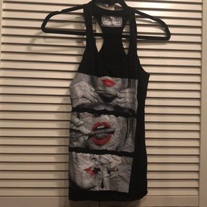 Racer back tank. Girl rolling blunt